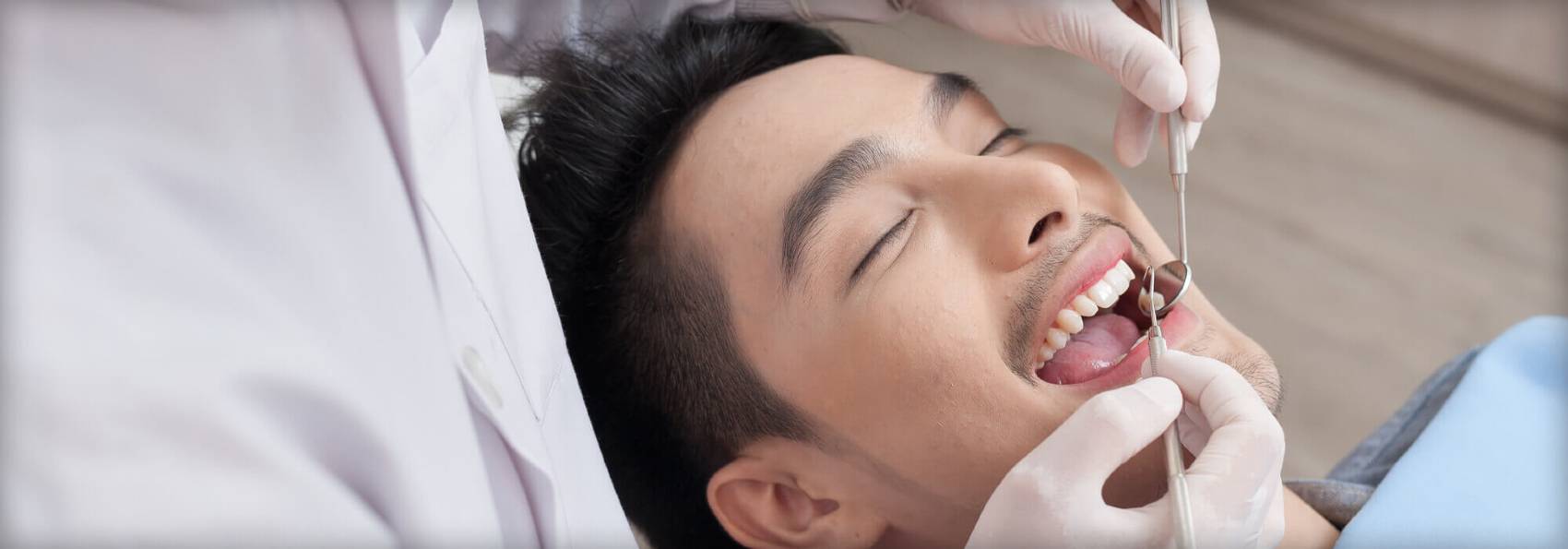 Ourservices man in dental chair