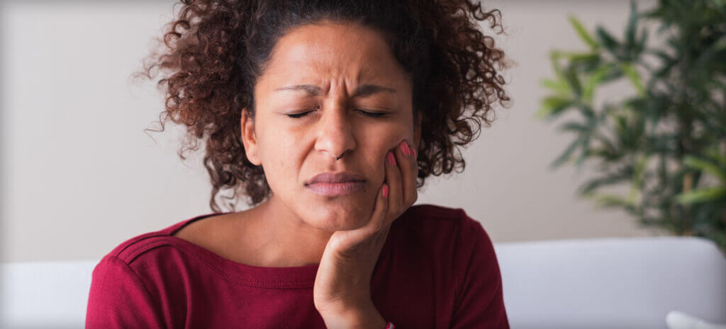 Ourservices Emergencydentistry 1024x465 1 woman having tooth pain