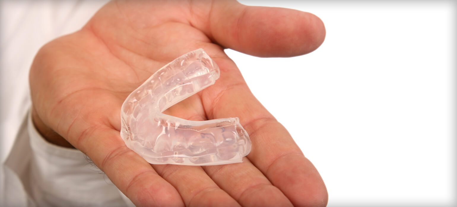 Ourservices Mouthguards Mouthguard in hand